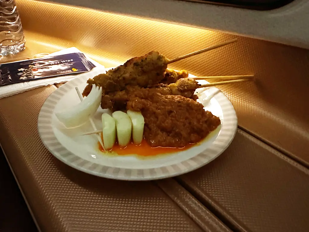 Chicken satay with onion, cucumber and spicy peanut sauce., Singapore Airlines SQ22 SIN-EWR A350-900ULR