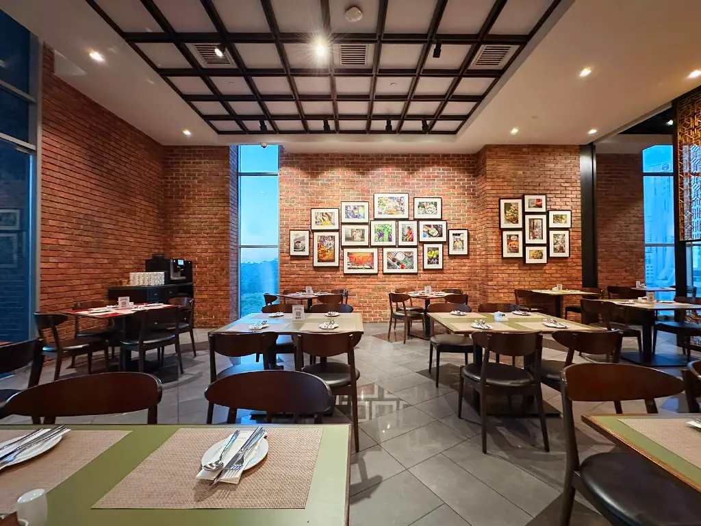 The open layout at Quan's Kitchen, Four Points by Sheraton Kuala Lumpur, Chinatown, creates a welcoming and social dining experience