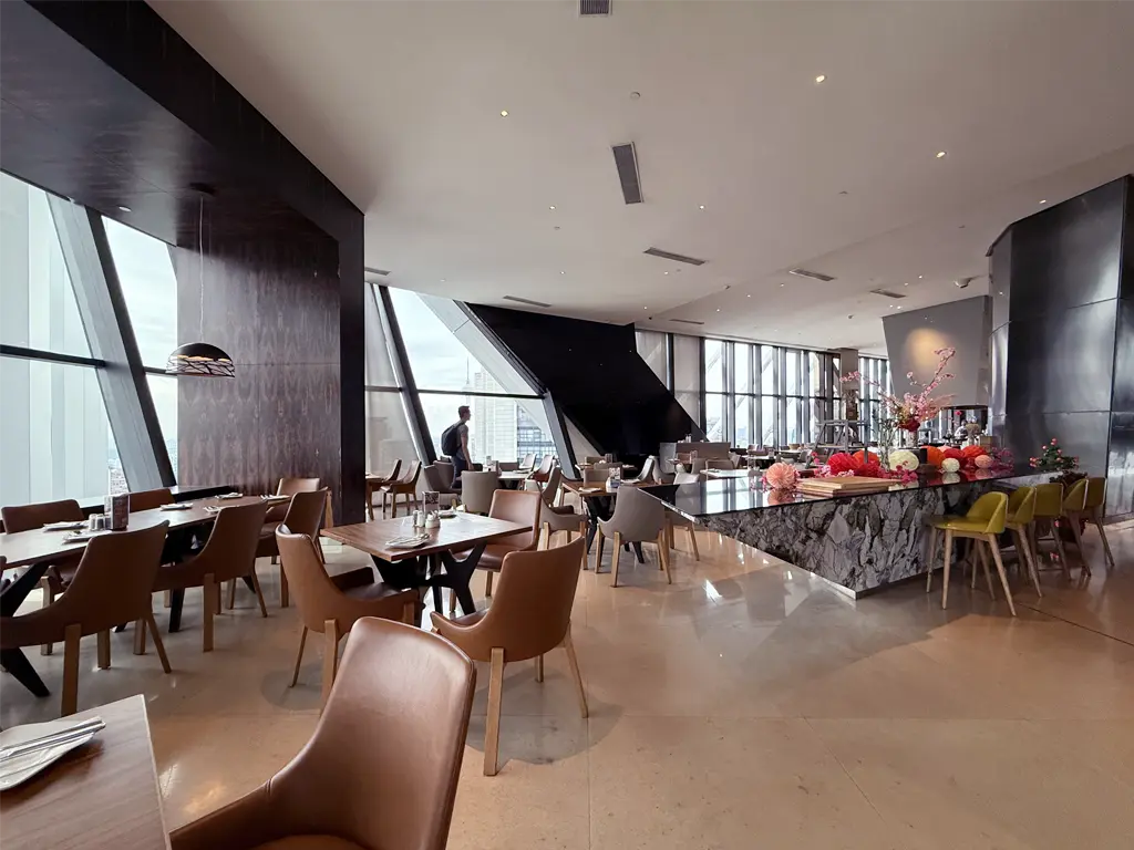 Floor-to-ceiling windows and a variety of seating options at TRACE Restaurant & Bar, Element Kuala Lumpur